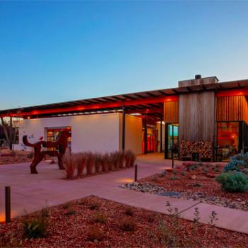 Modern building in Utah desert at sunset